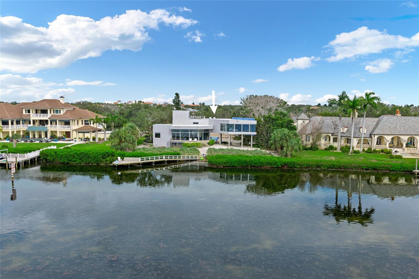 This ultra-modern home, designed by renowned architect Carl Abbott, seamlessly brings the beauty of the outdoors in through its expansive walls of windows.