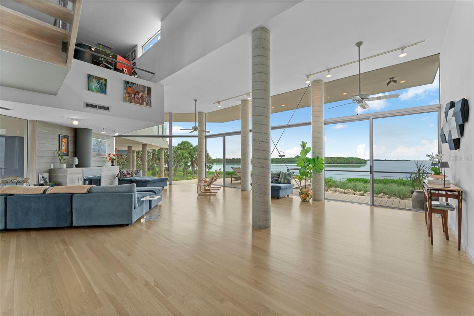 Enjoy spacious living with a seamless flow between indoors and the expansive Gulf and the island view outdoors.