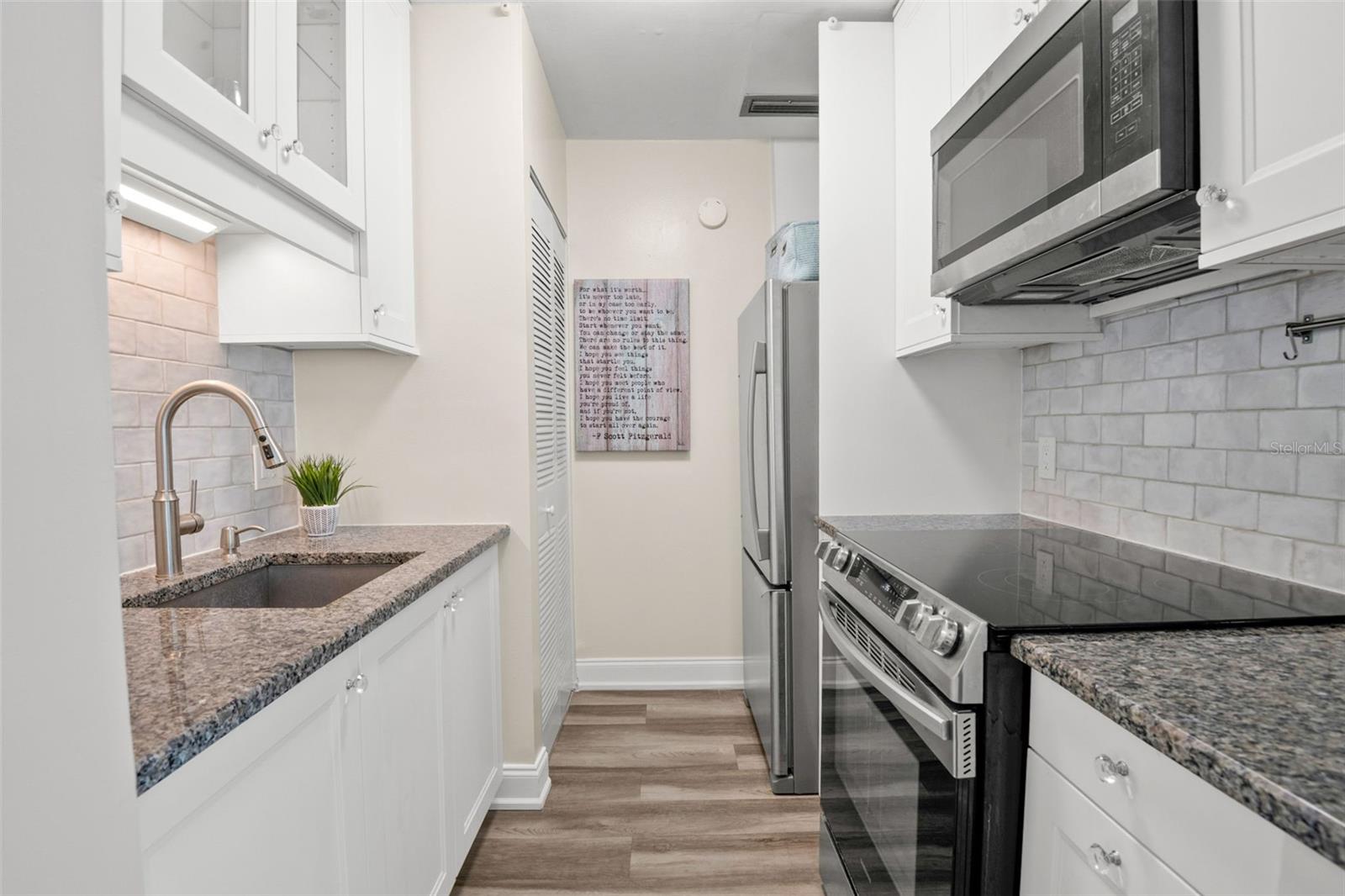 Granite Counters, Solid Wood Cabinetry, New Electrical Panel (behind picture)