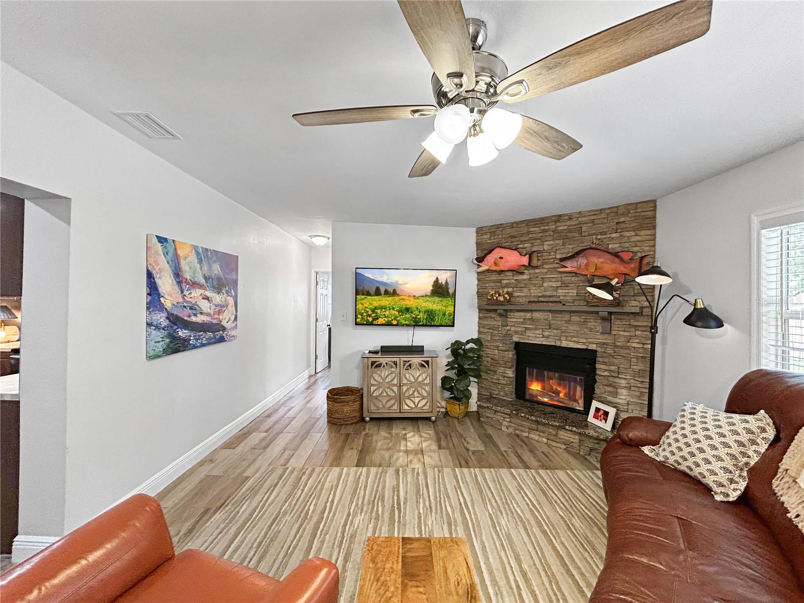 FAMILY ROOM WITH COZY WOOD BURNING FIREPLACE