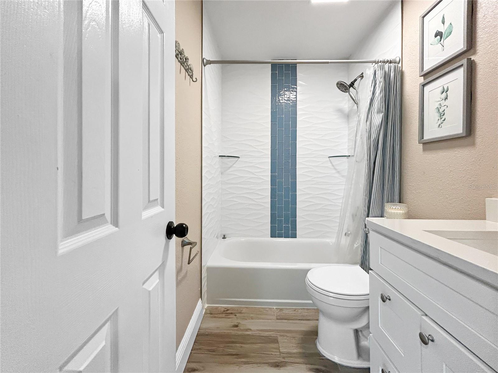 NEWLY RENOVATED TUB BATH IN HALLWAY BY BEDROOM # 2 AND #3