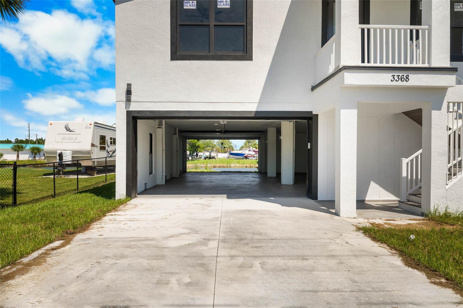 Drive through garage to boat ramp