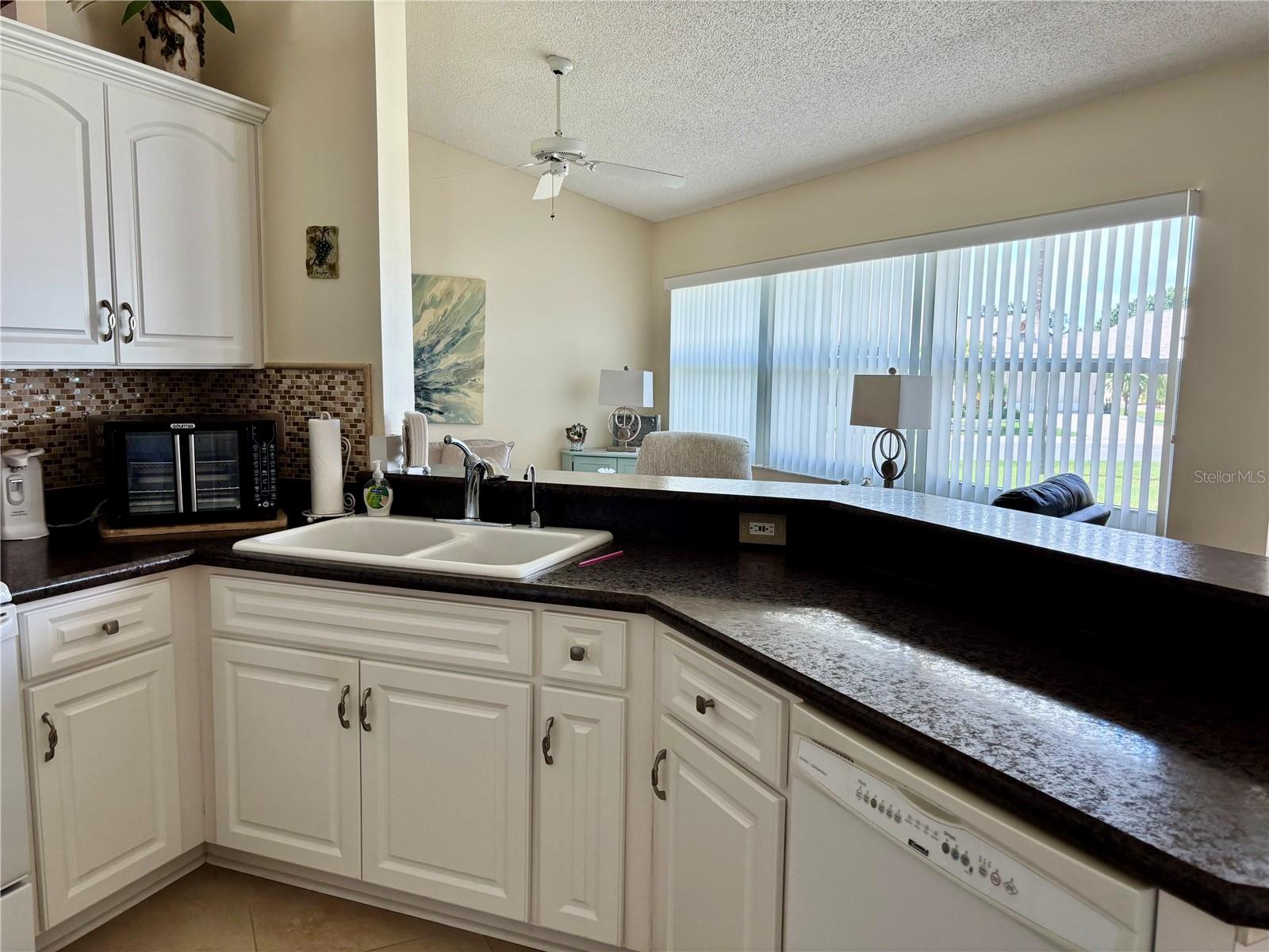 Kitchen with view of family room