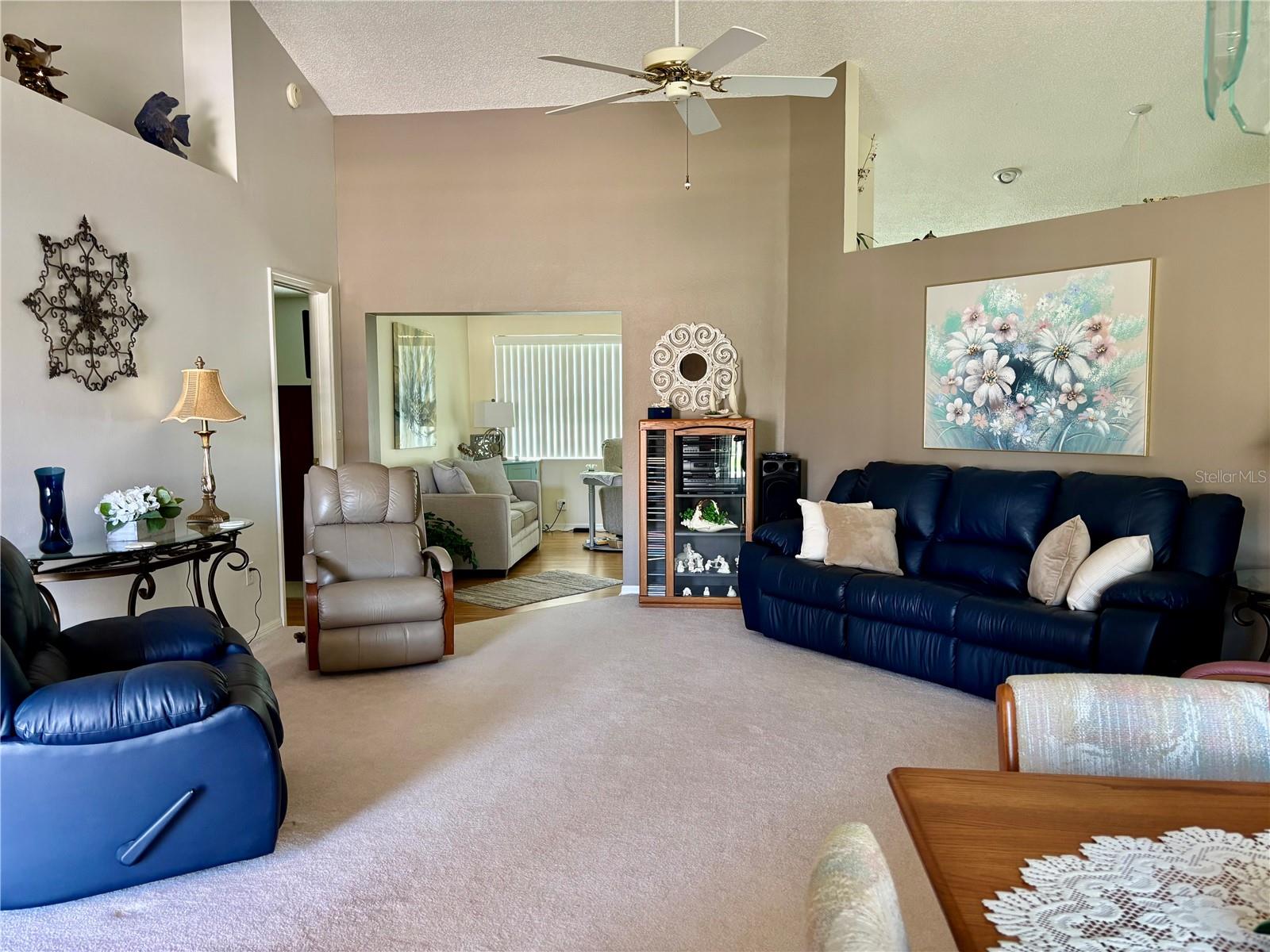 Living room with view of family room entrance