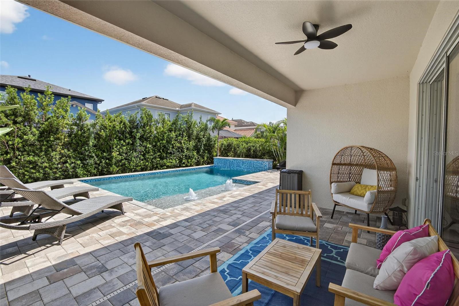 Amazing pebble tech salt water pool with pavered lanai and sun deck