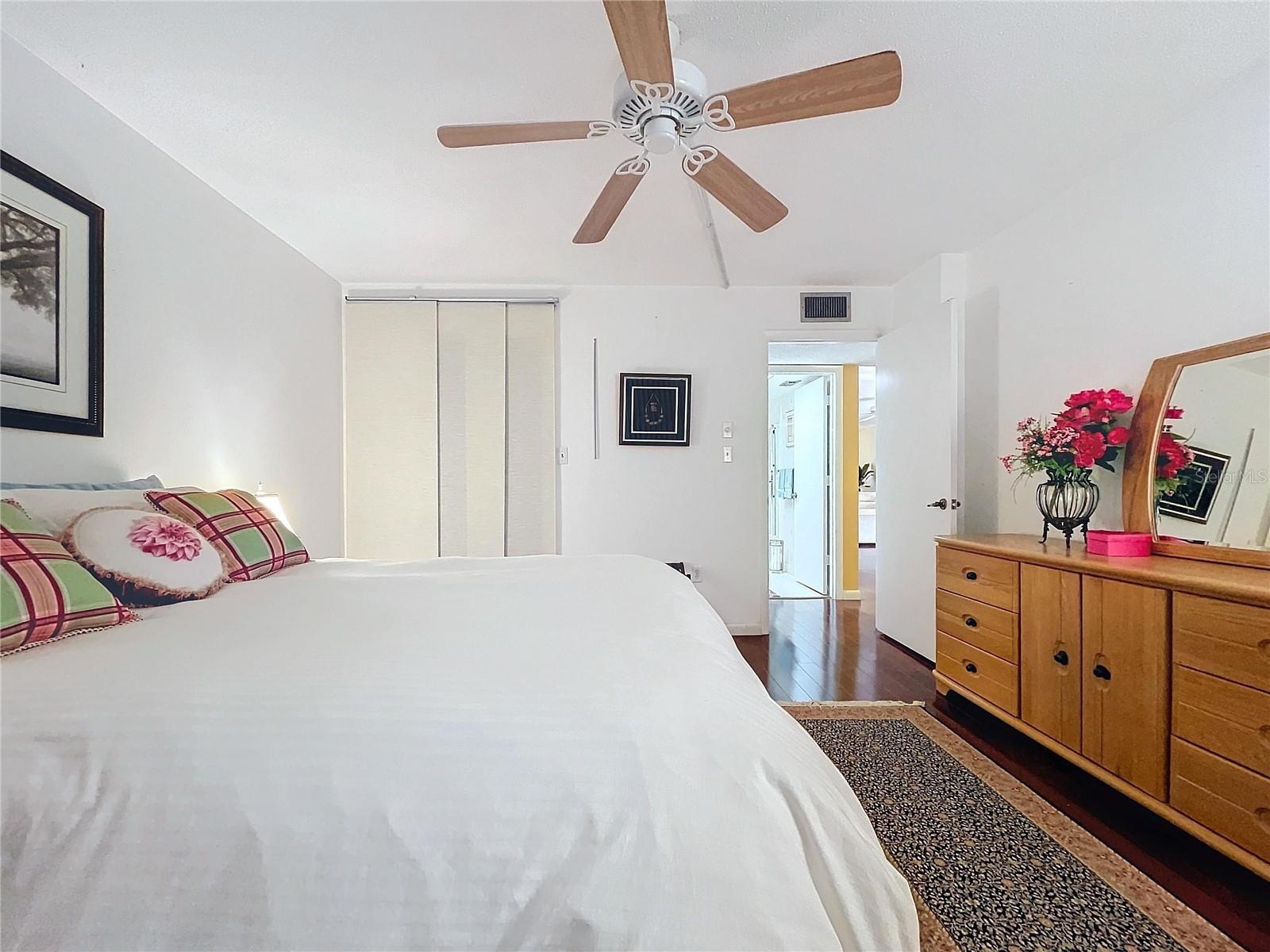 This bright and cozy space includes warm natural tones, charming decor, and easy access to the ensuite bath.