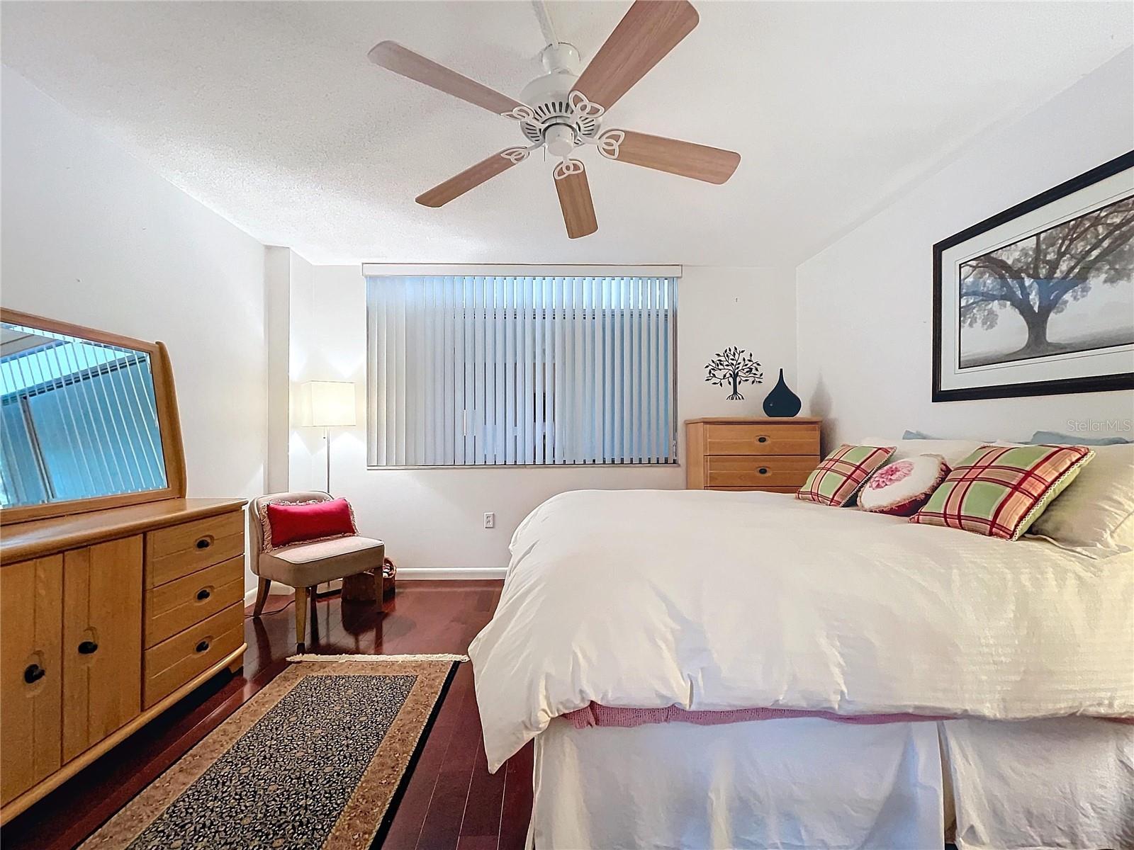 A wide layout offers plenty of room for additional furnishings, with convenient flow into the main hallway and bathroom.