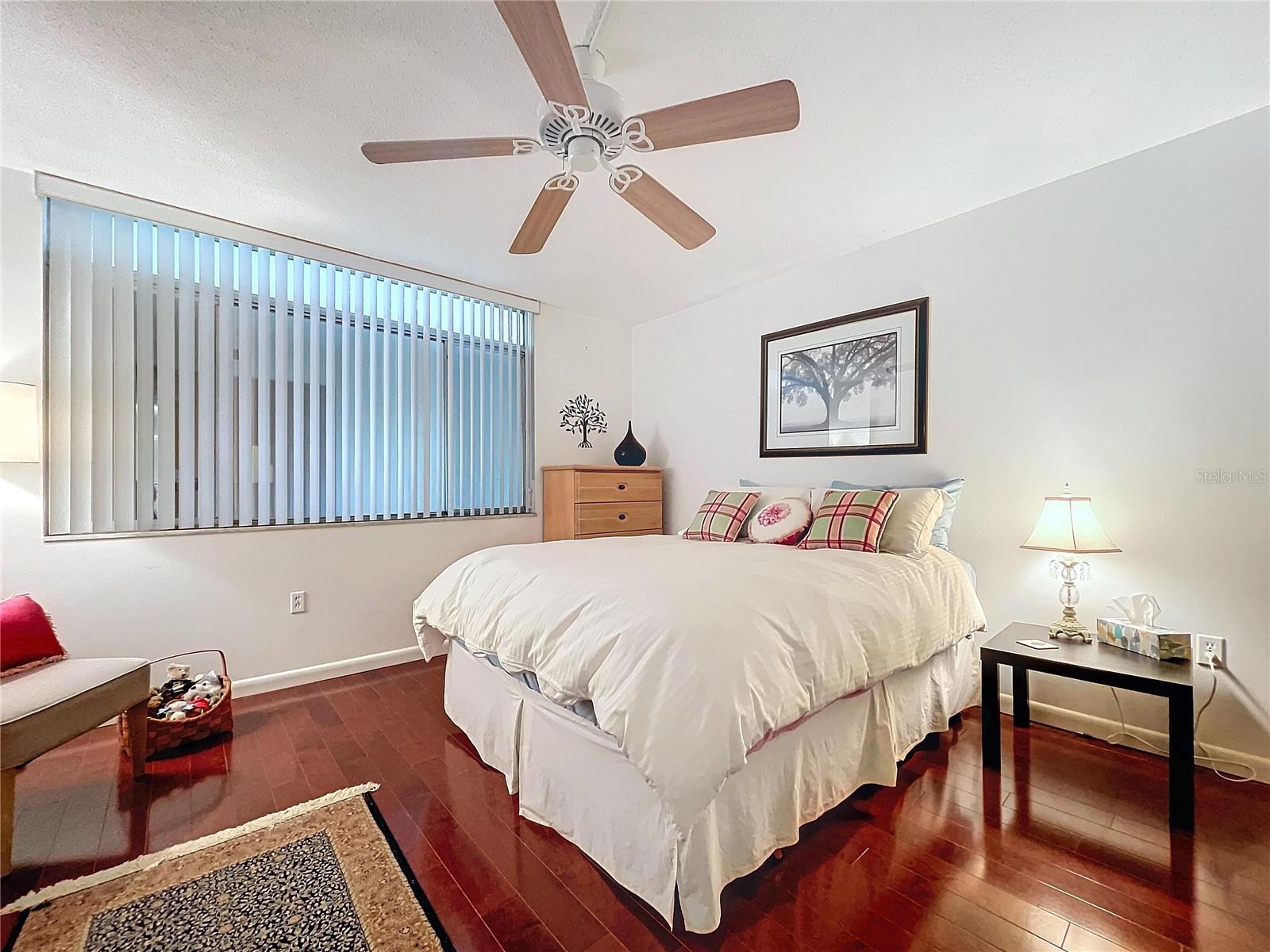 Full view of the room shows thoughtful furniture placement, soft ambient lighting, and an inviting layout.