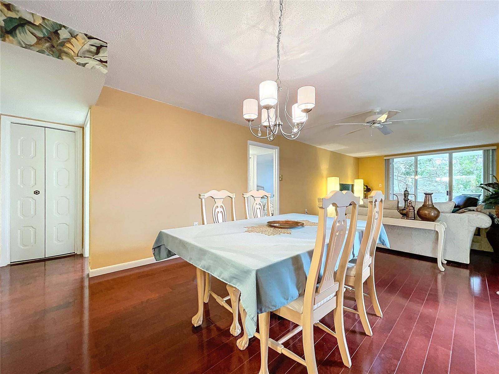 A closer look at the dining space reveals classic white furniture and convenient access to multiple areas of the home.