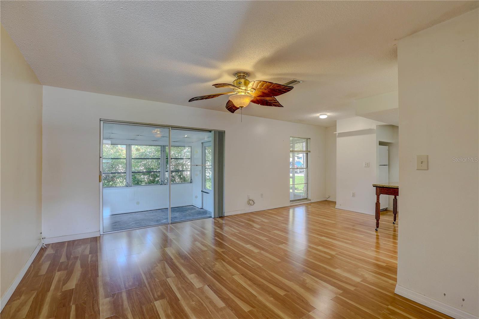 Living room with Sliders to the Enclosed Porch