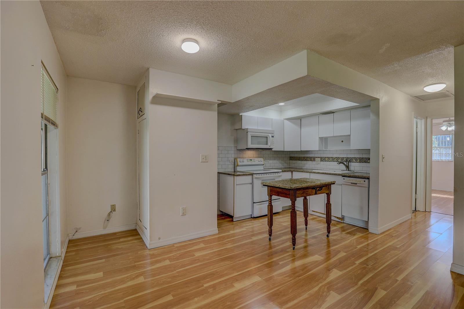 Functional kitchen with Granite countertops & a custom Island to match