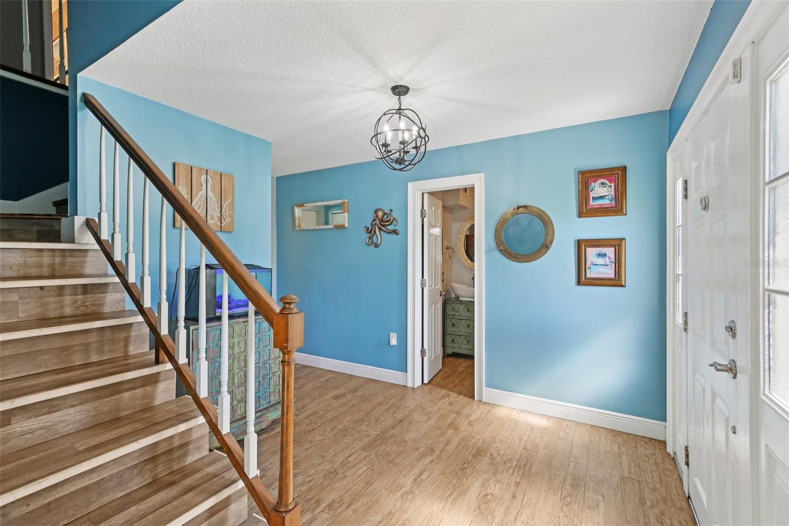 Entryway with door to full bathroom