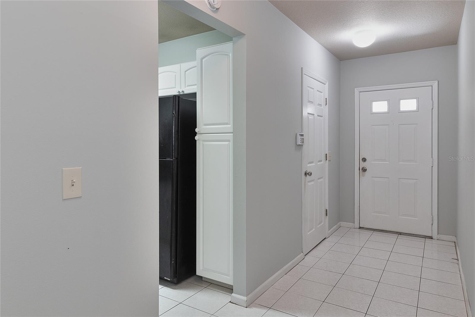 Entry way and door to the 1-car garage.