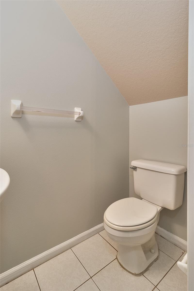 Under stairway half bathroom.