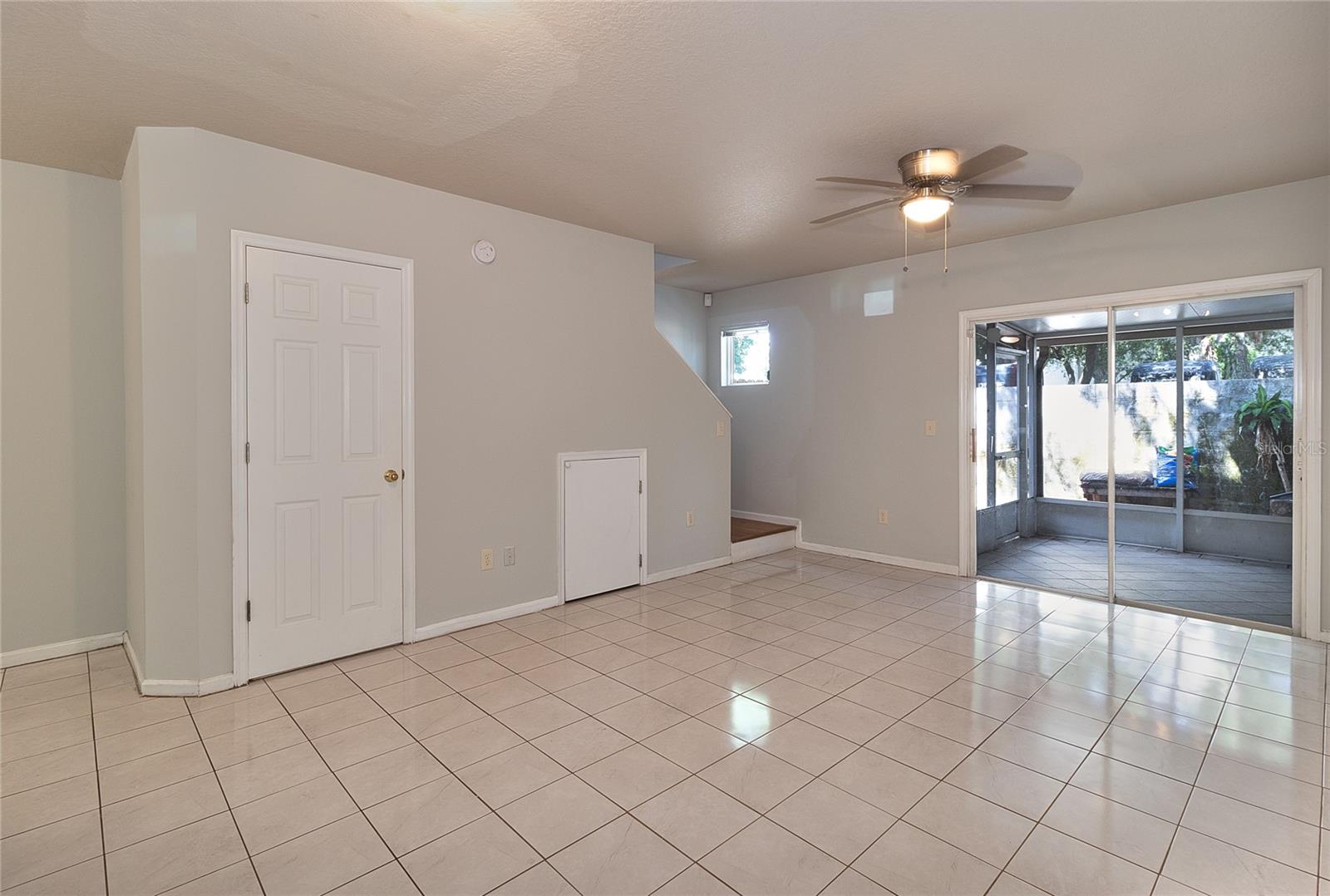 Living room - Left Door is downstairs half bathroom.