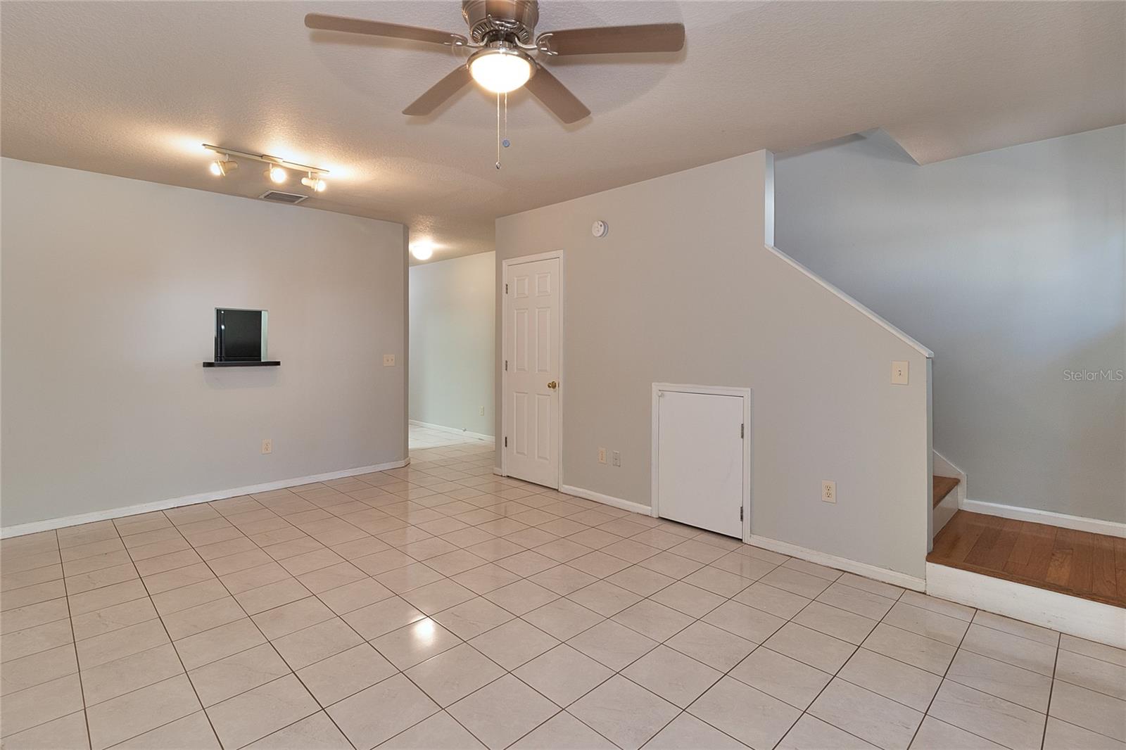 Right door is storage area under the stairway.