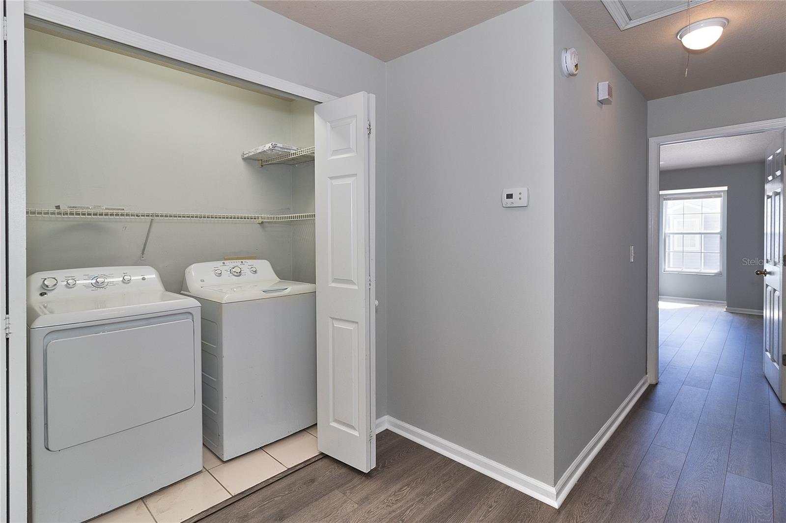 Washer & Dryer in double closet at top of stairs.