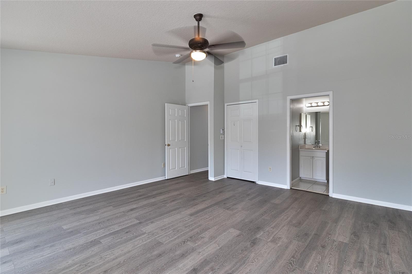 Primary bedroom with ensuite bathroom and walk-in closet.