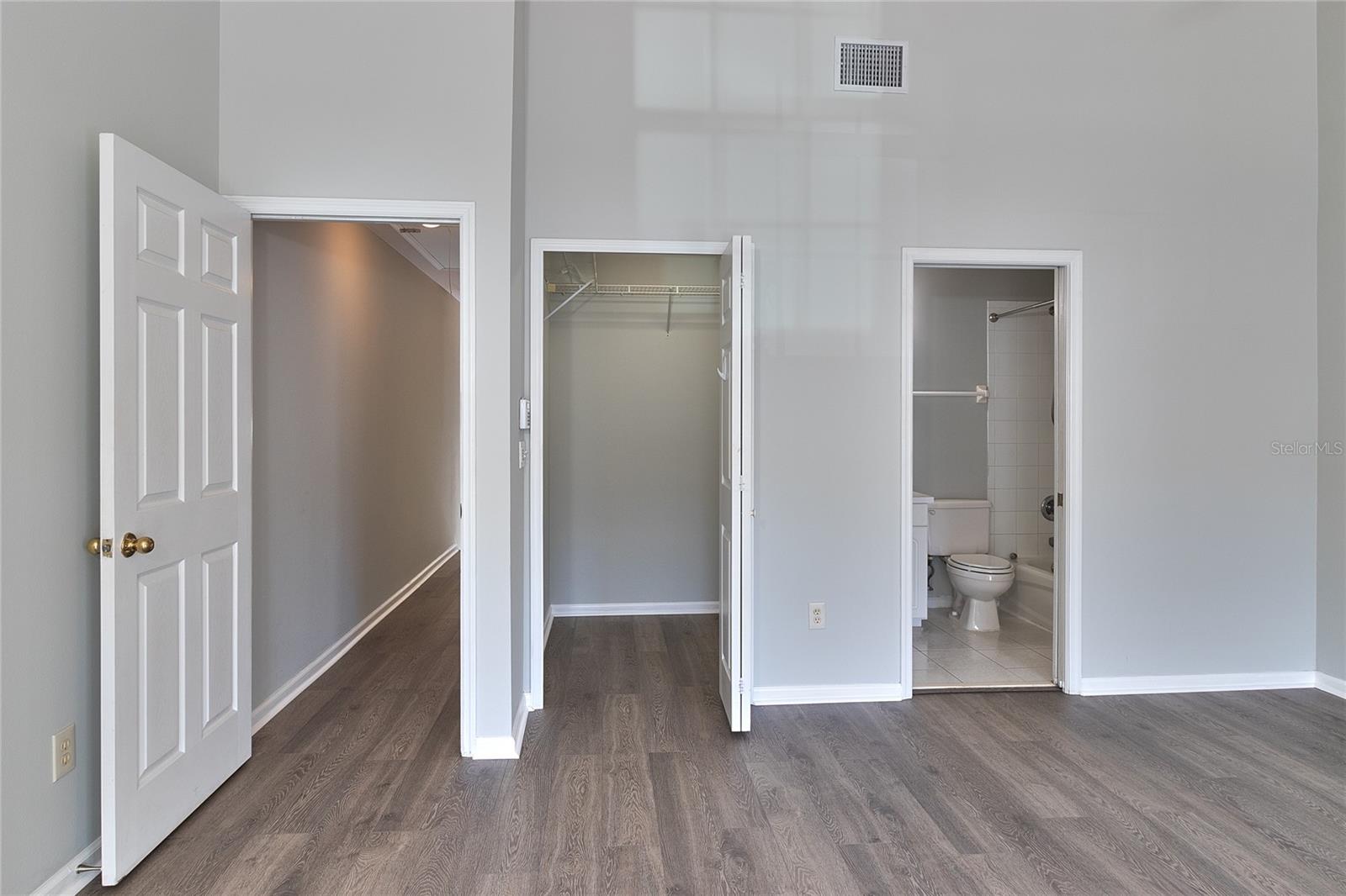 Left door goes to the hallway. Middle door is the walk-in closet and 3rd door is to the ensuite bathroom.