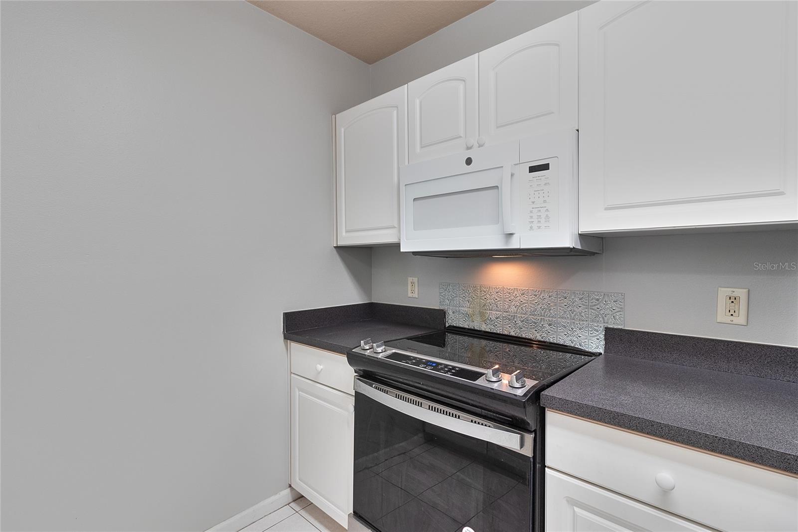 Closer view of microwave & range.