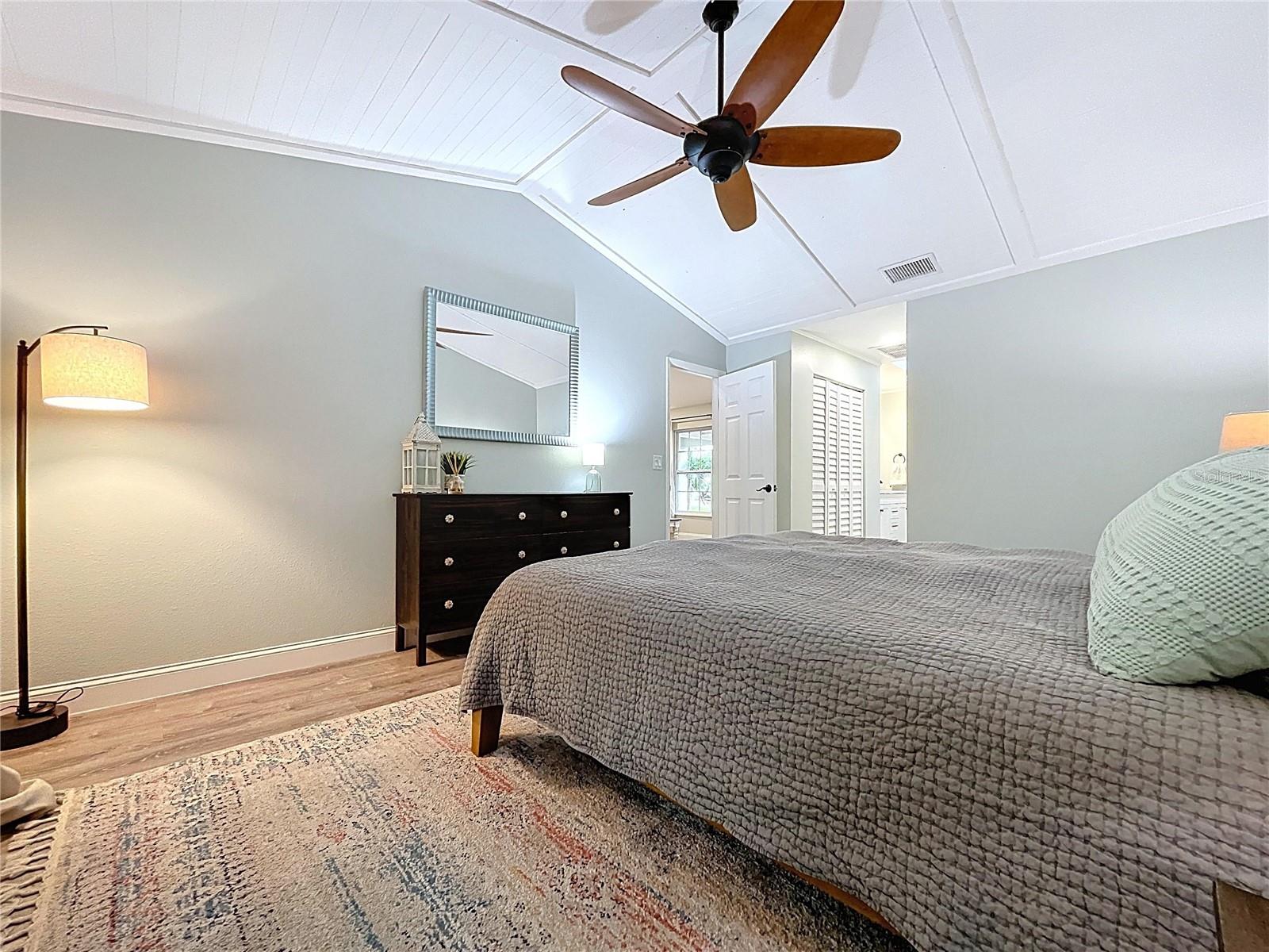 Warm and airy layout leads to the en suite bath, complete with vaulted ceilings and a cozy, inviting atmosphere.