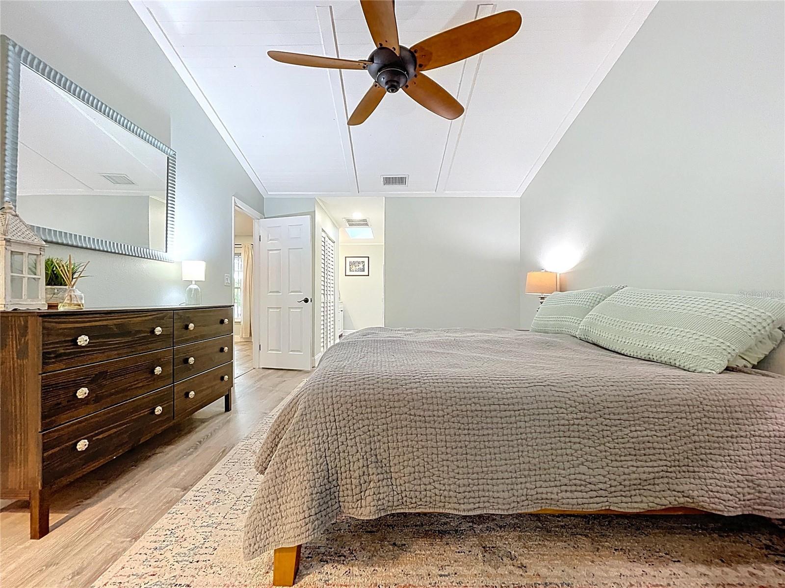 Additional view showcasing functional flow, natural textures, and easy access to the bathroom and storage areas.
