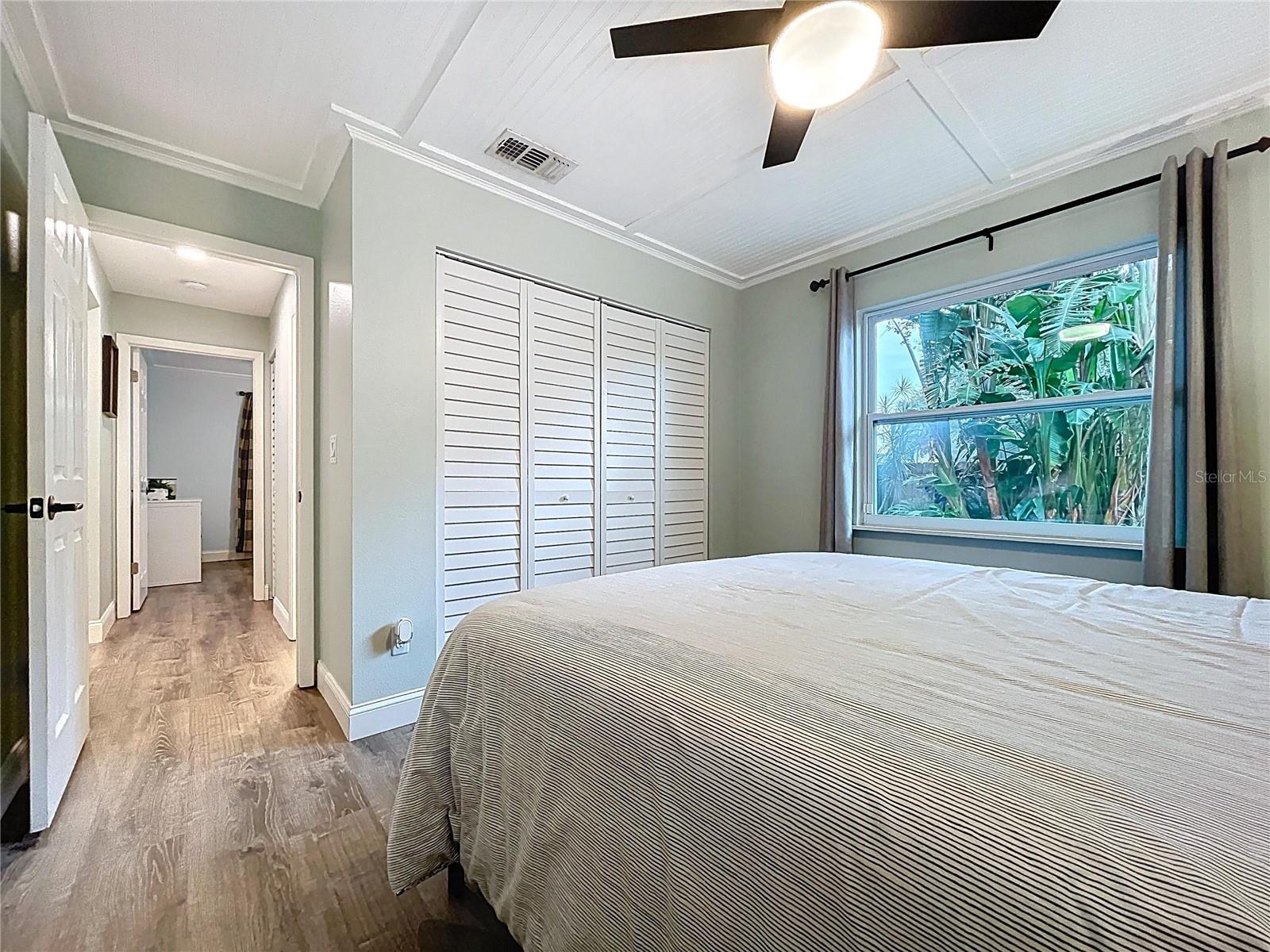 Comfortable secondary bedroom with clean lines, ample storage, and easy access to the hallway bath.