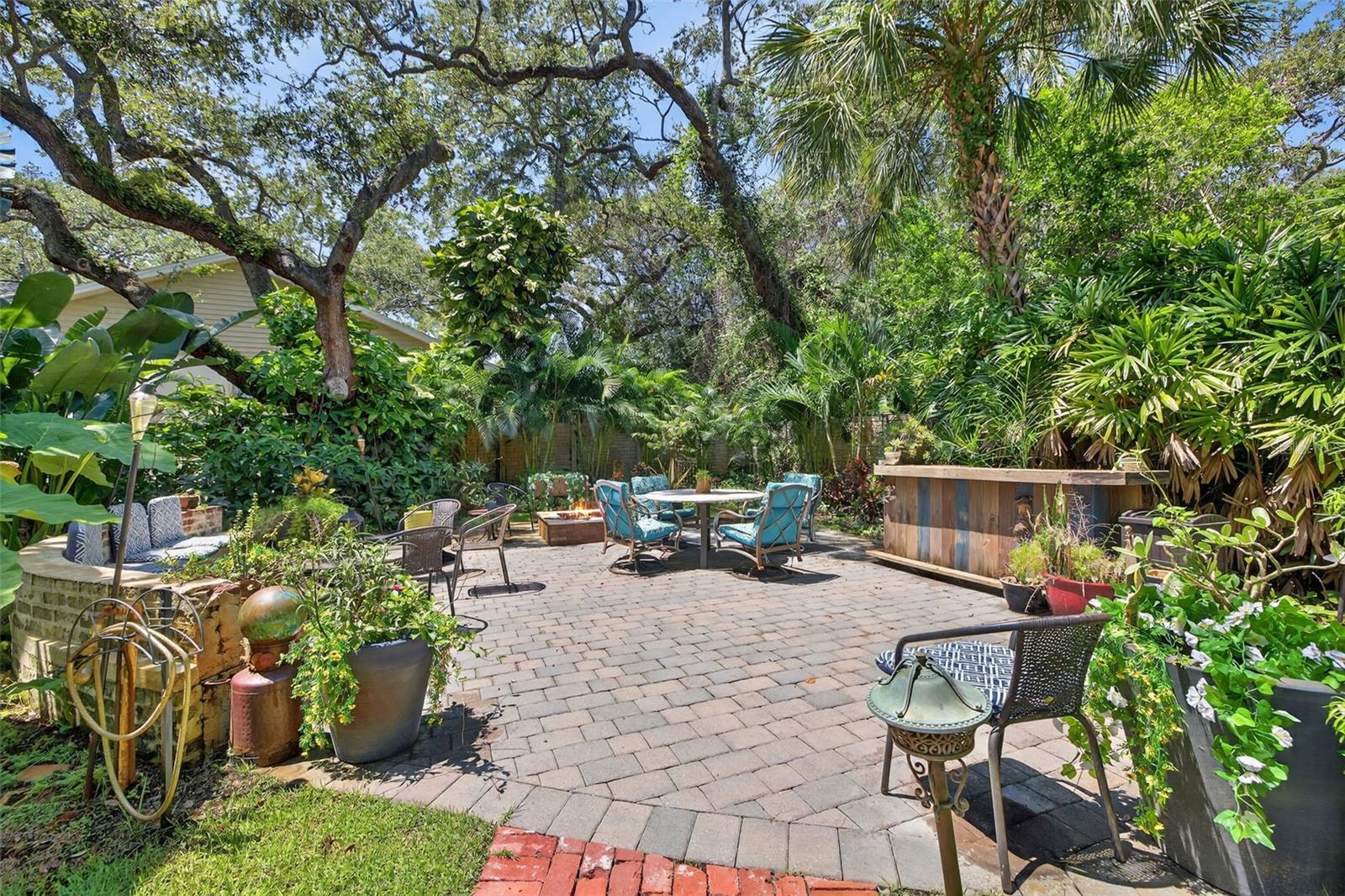 Plenty of seating for entertaining large groups. Firepit and bar