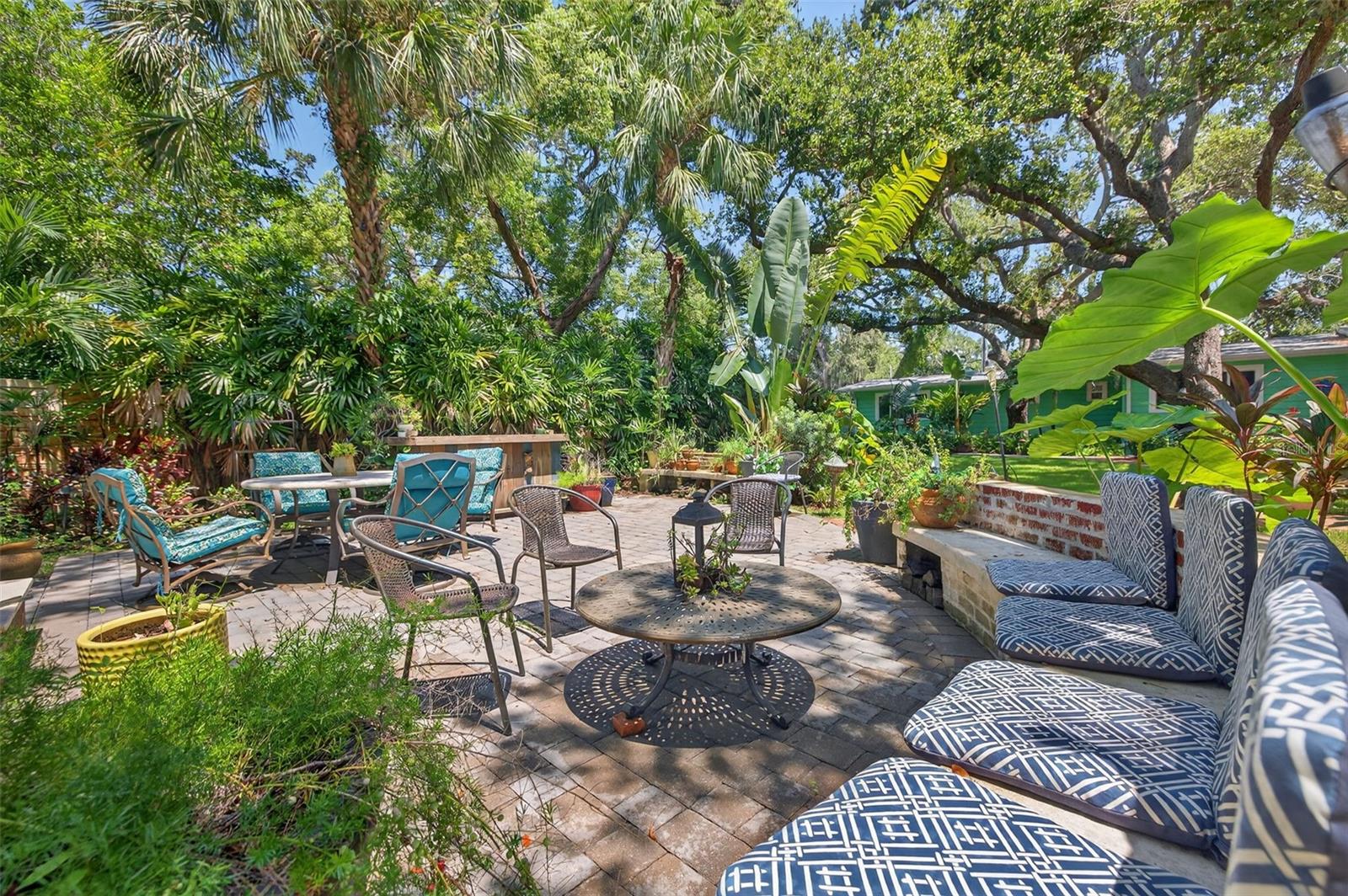 Plenty of seating for entertaining large groups. Firepit and bar