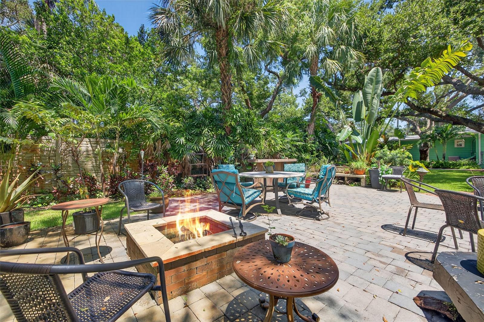 Plenty of seating for entertaining large groups. Firepit and bar