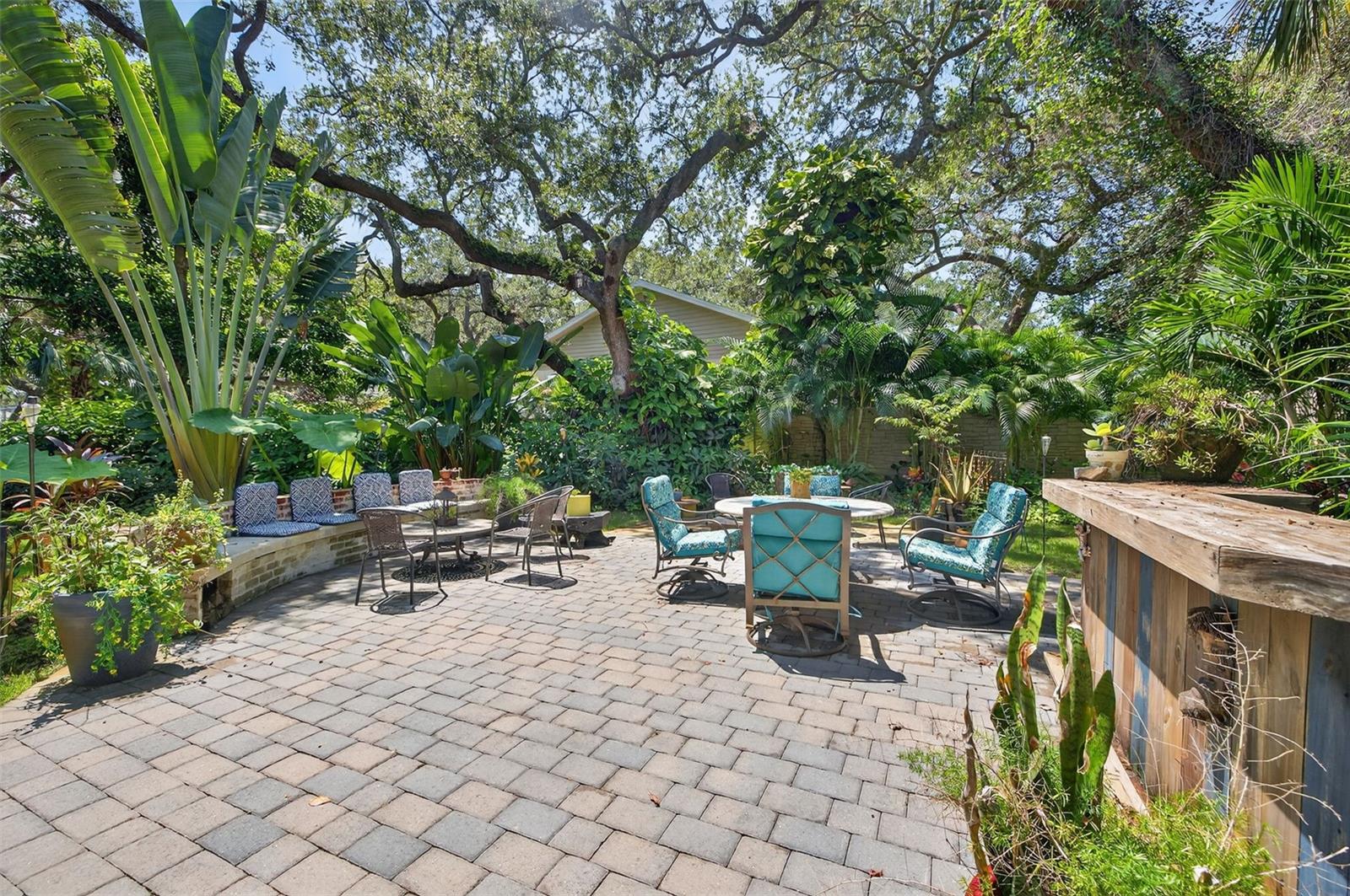 Plenty of seating for entertaining large groups. Firepit and bar