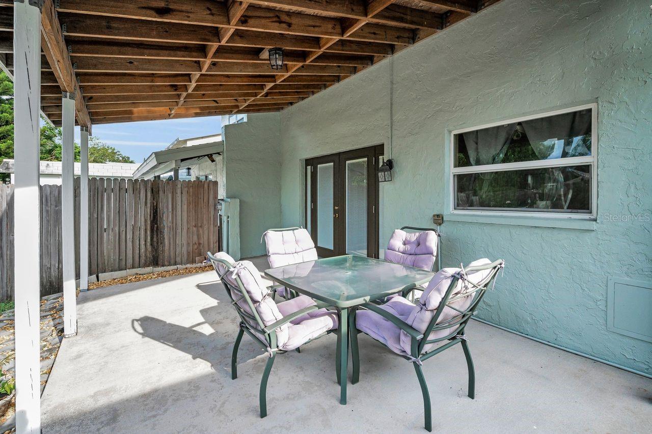 Covered rear patio off of dining area.