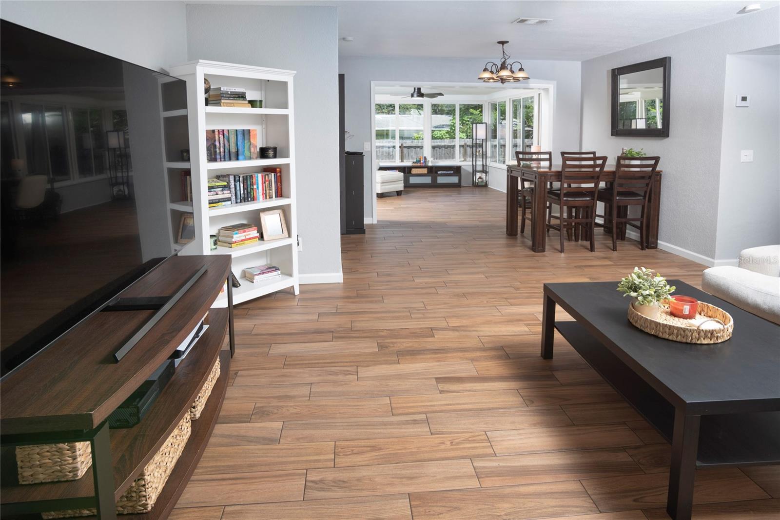 From front door, the flow of the house is so good, to the right are the bedrooms and bathroom, straight ahead is the sunroom at the end and to the left is the kitchen and at the end, breakfast nook and garage entrance.