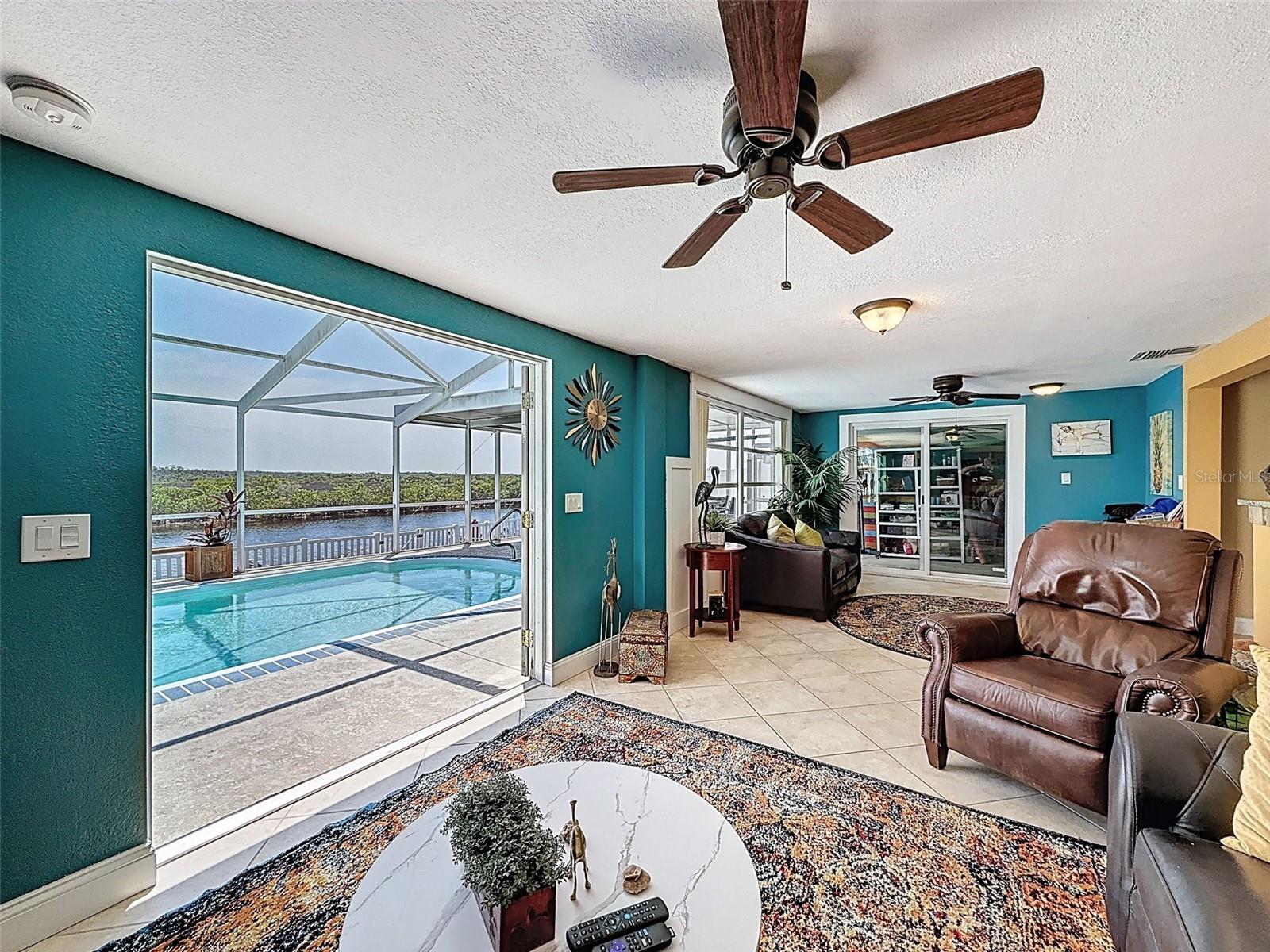 YOUR FAMILY ROOM WITH QUITE THE VIEW OF THE PERSERVE AND POOL..