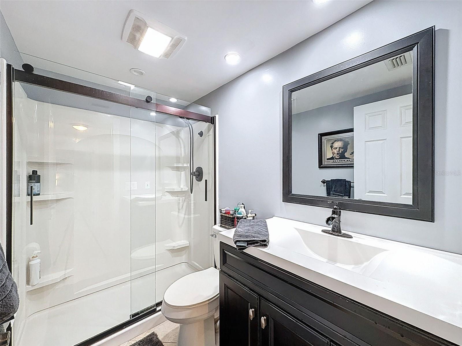SHOWER BARN DOOR IN THE HALL BATHROOM