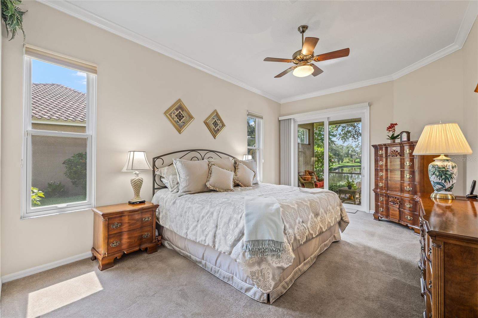 Primary bedroom provides natural light and a private slider to step outside for morning coffee or tea.