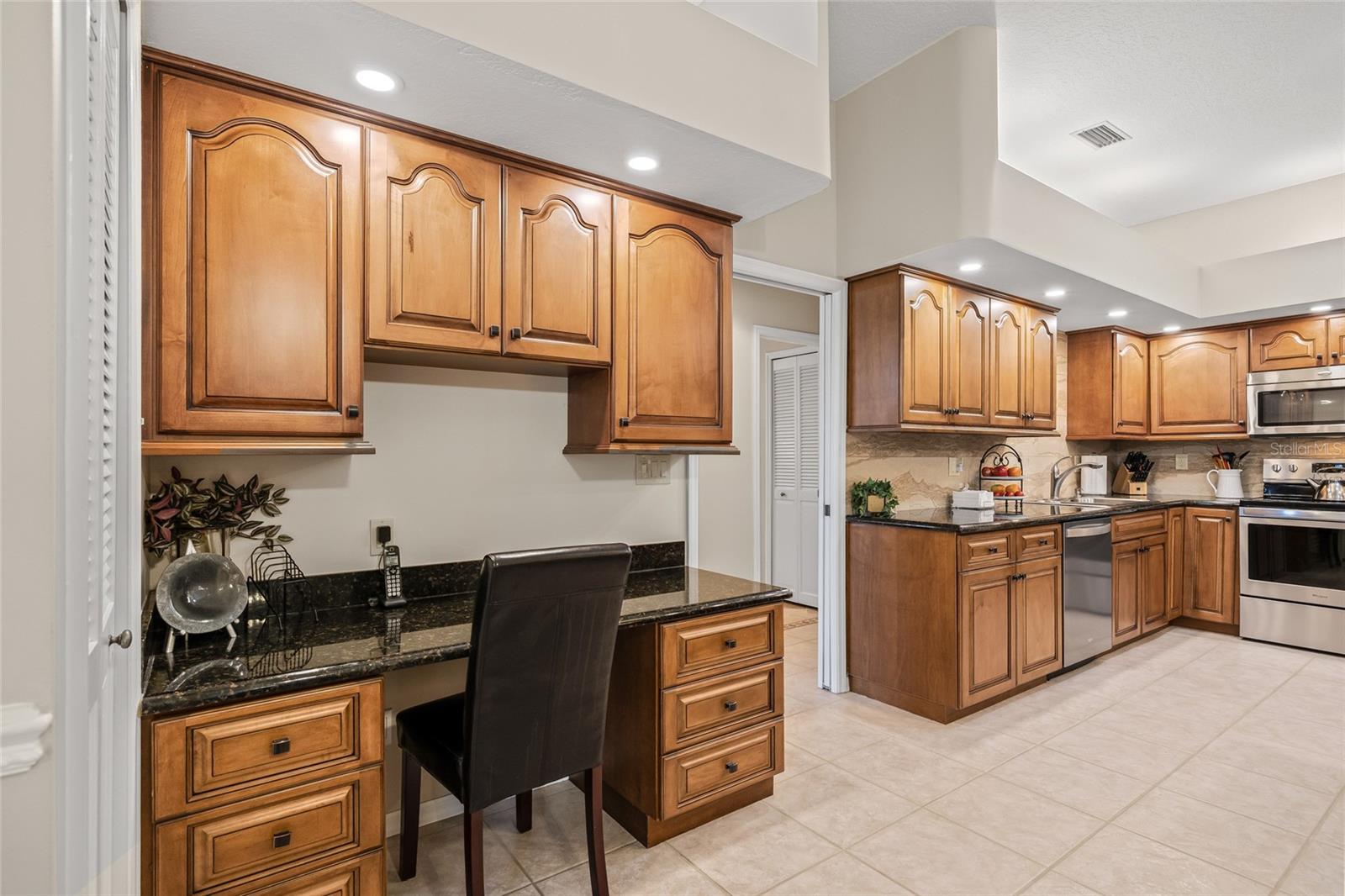 Built in desk space and storage.