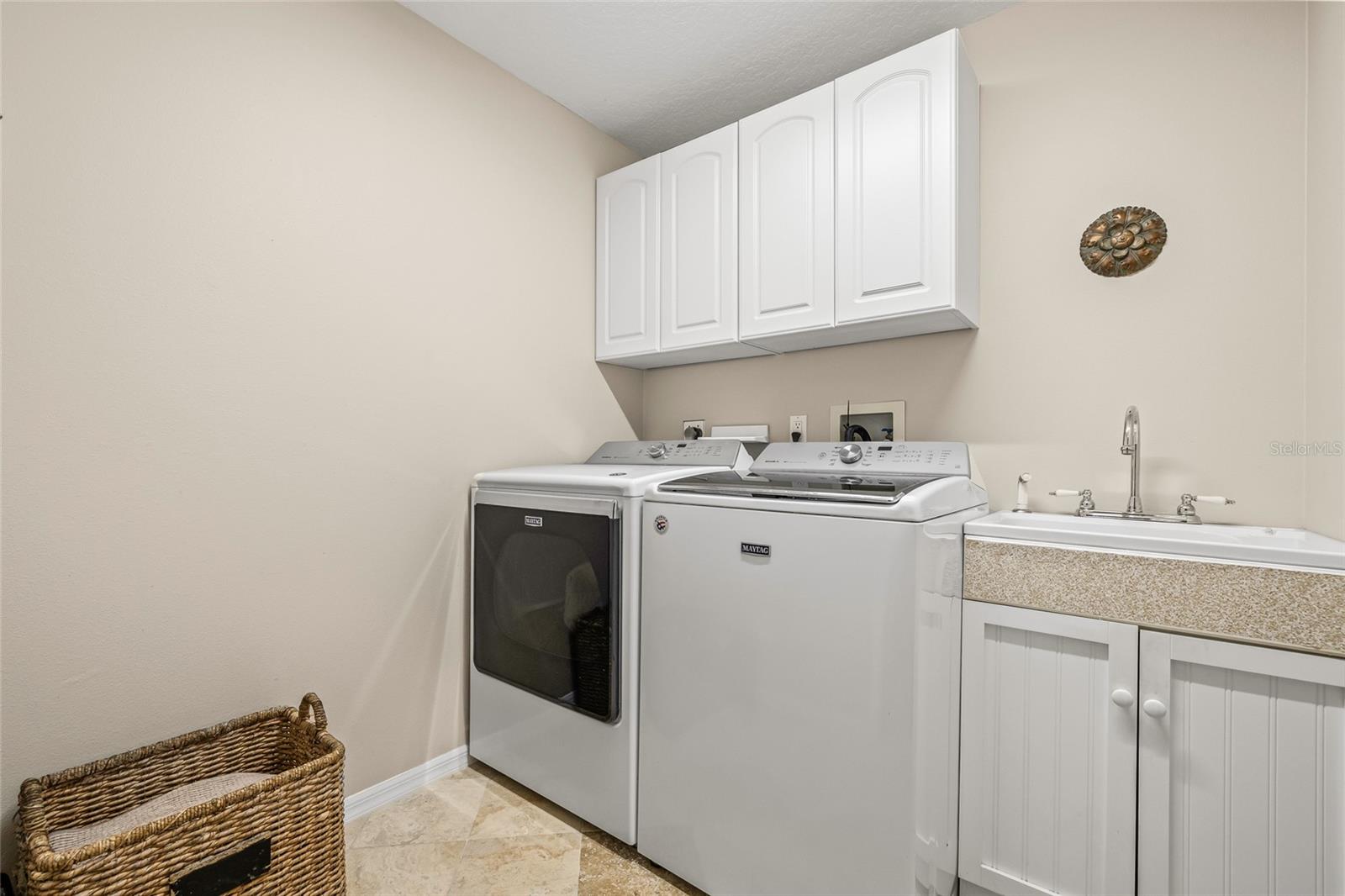 Interior laundry room with utility sink. Shut the door and laundry is out of sight!