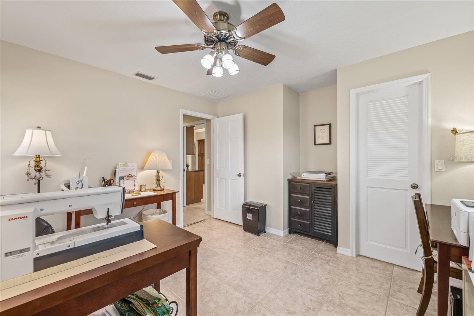 Second bedroom used as office and craft room.