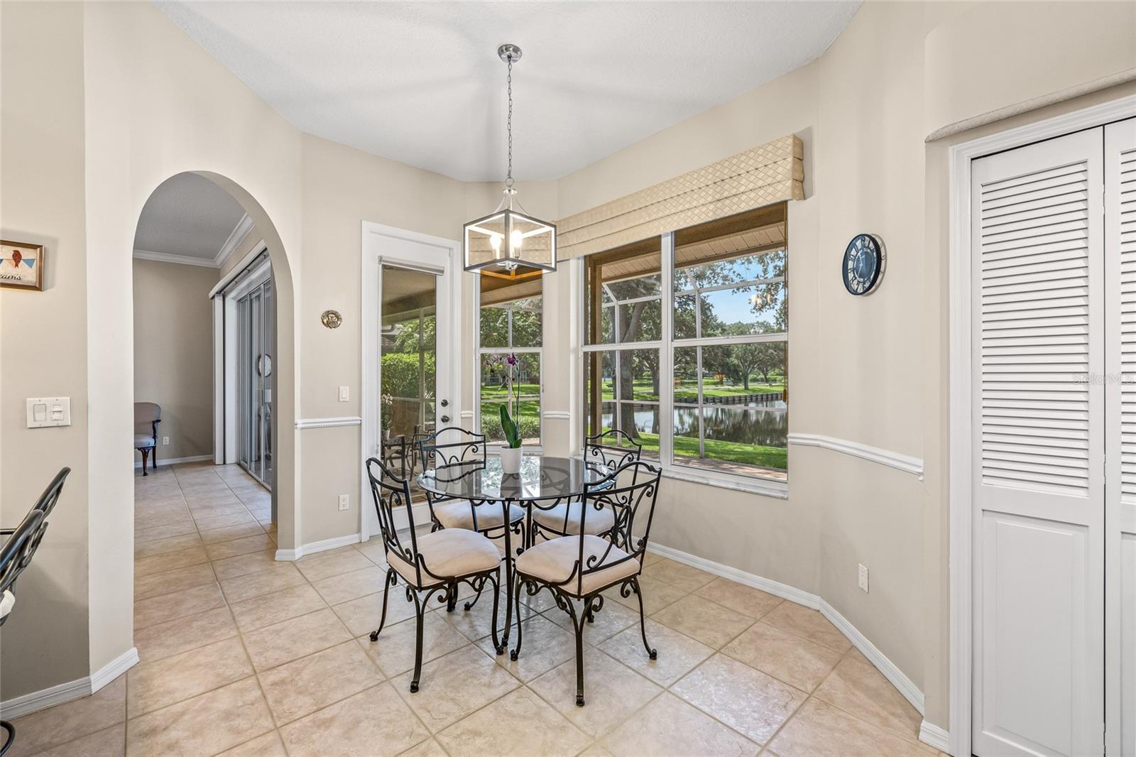Spacious dinette with additional dining space outside and in the dining room.