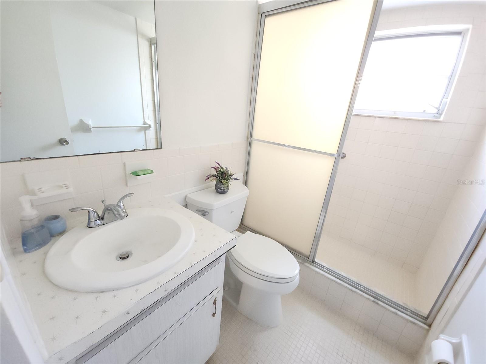 Primery bathroom with shower