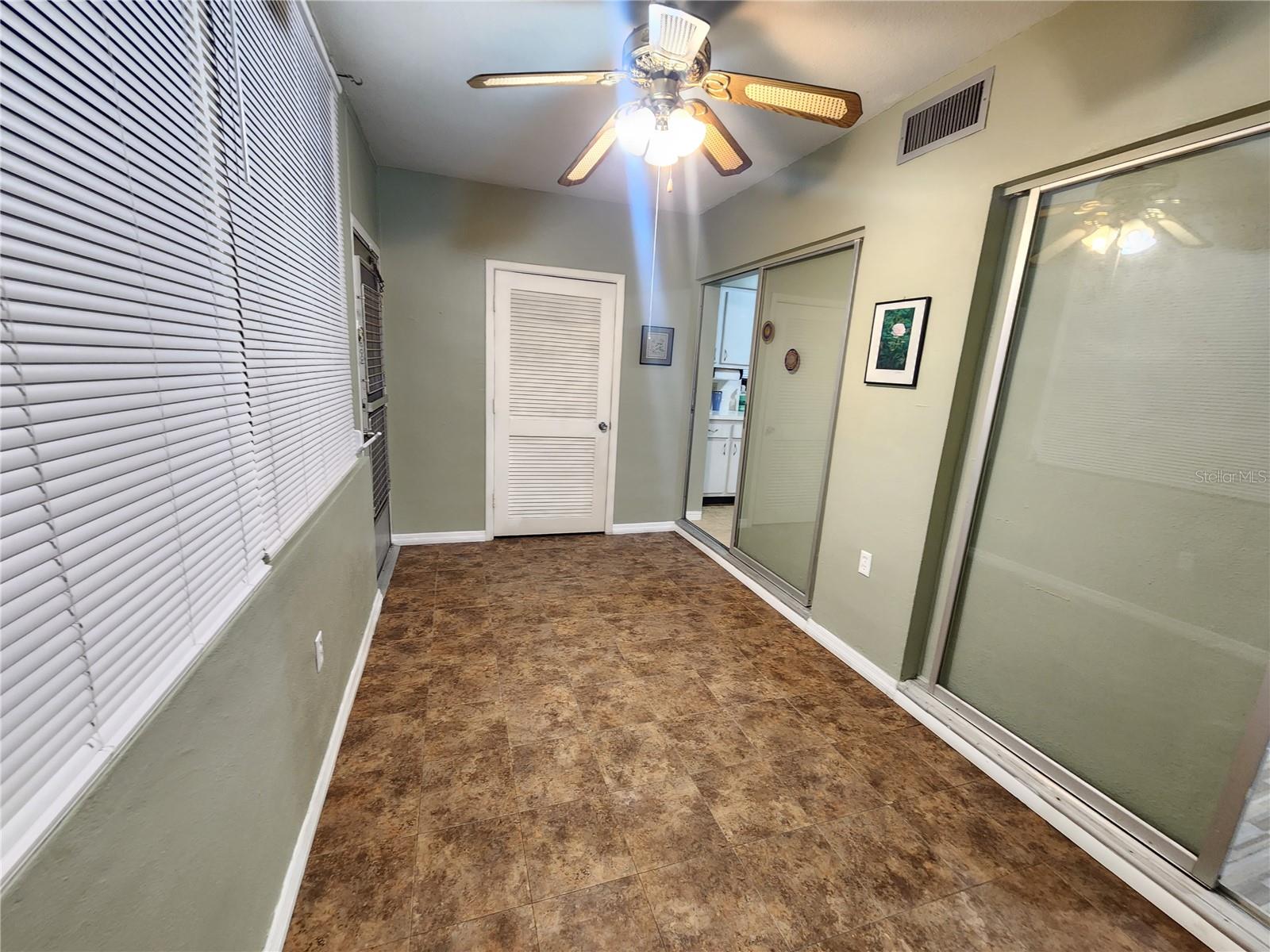 Third bedroom with outside access door . It can be used as a bonus room or office