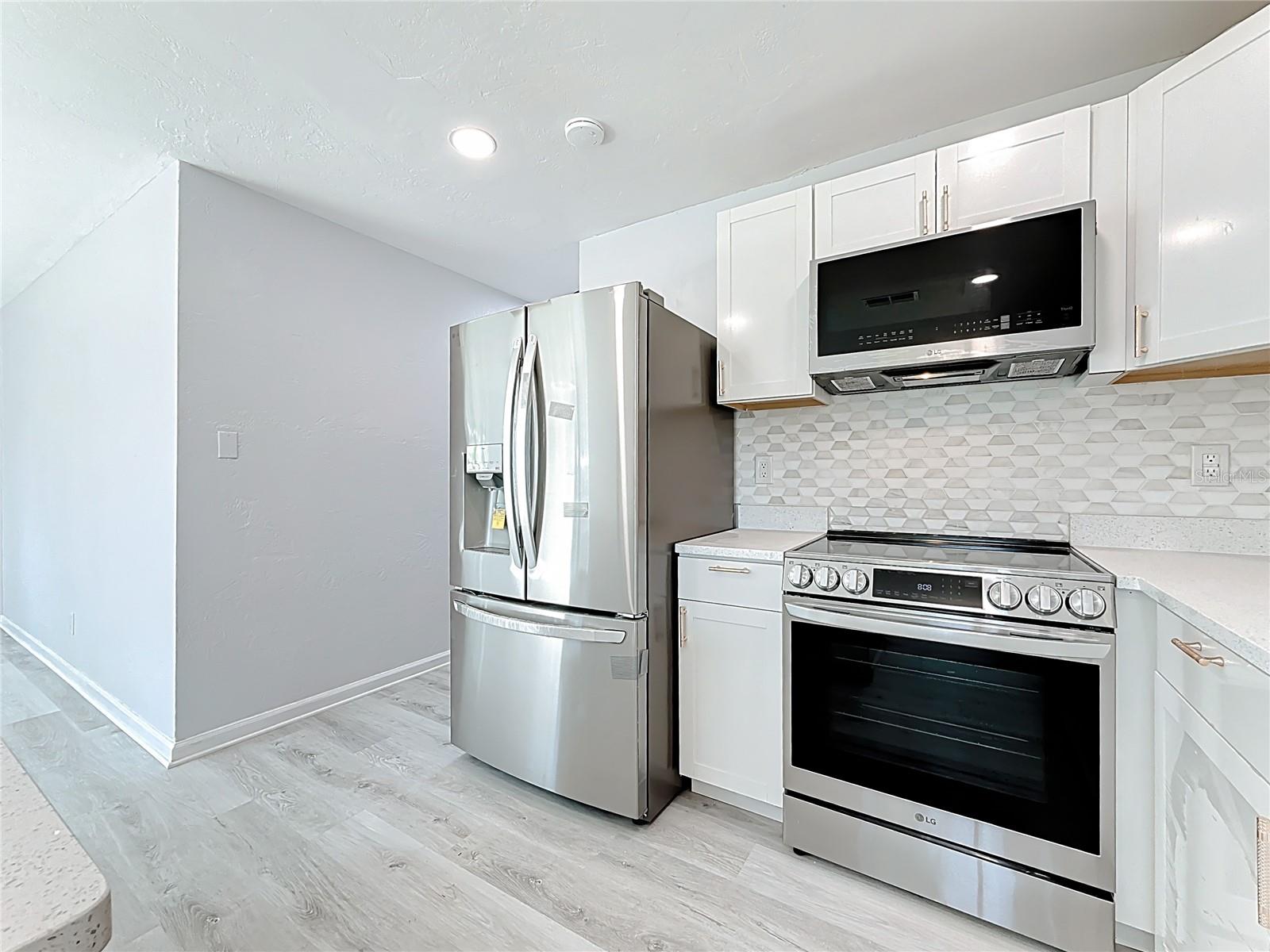 LG Refrigerator, LG Convection Oven and LG microwave, Bosch Dishwasher, Deep Sink, New Cabinets, Quartz Countertops, LED lighting