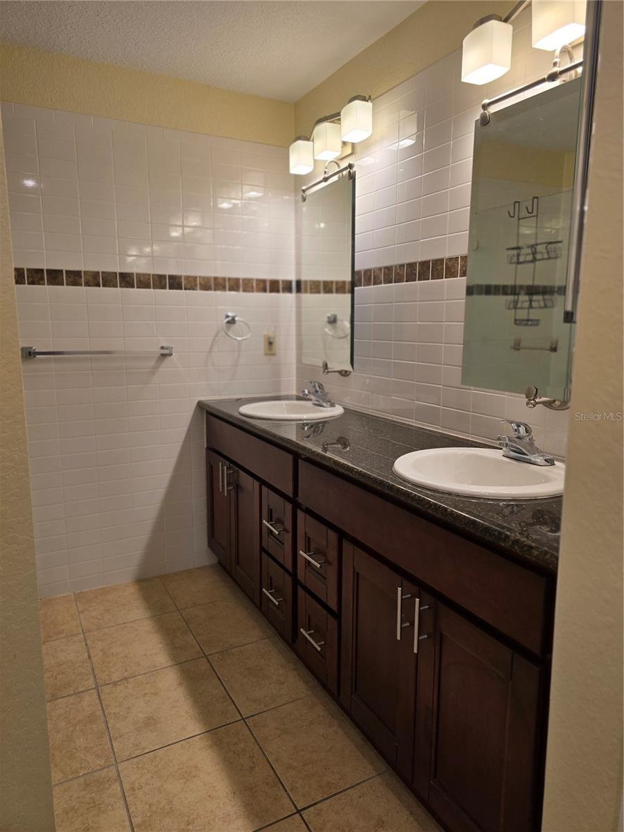 Large primary bath, double sinks and cabinetry/mirrors