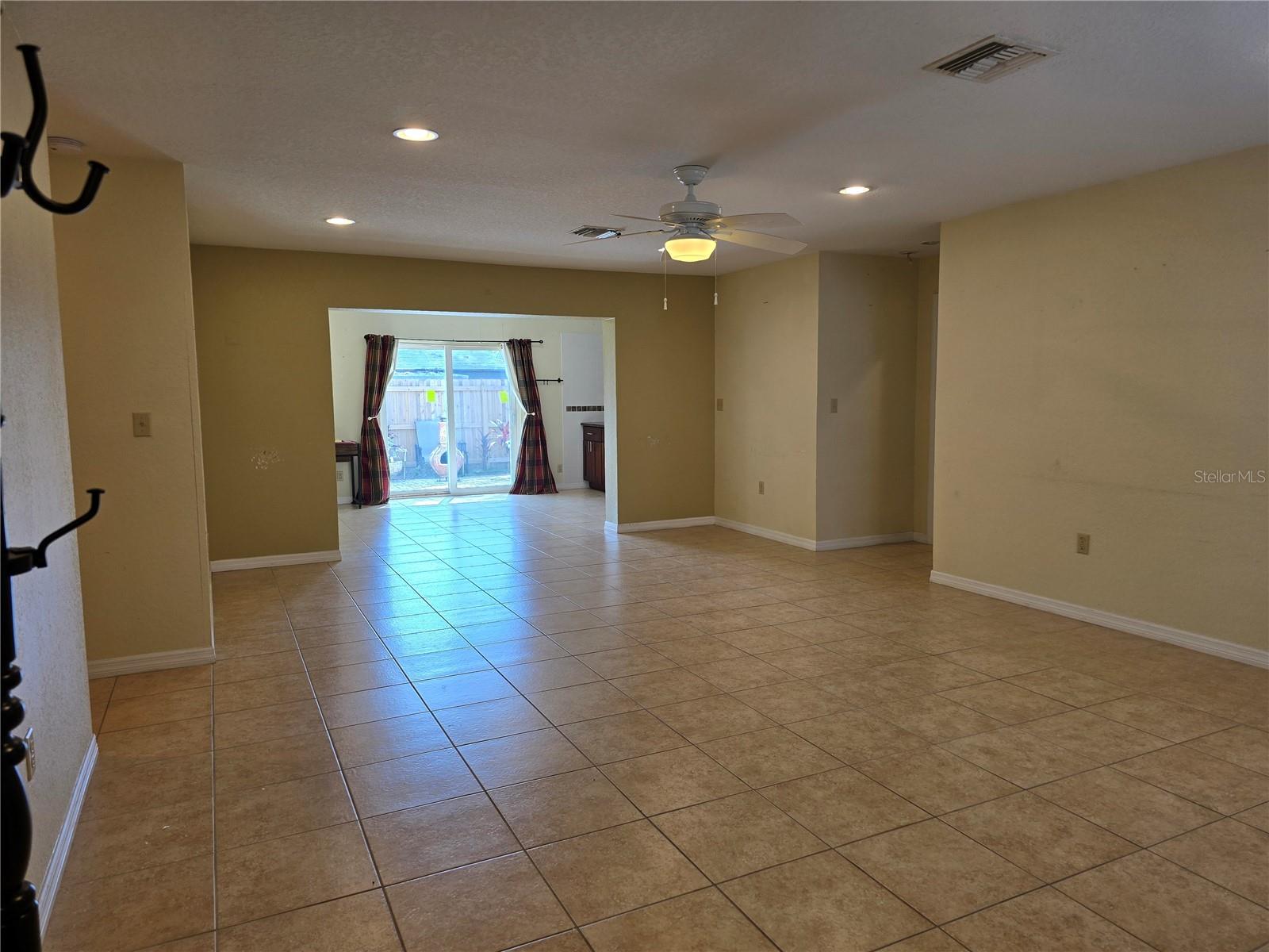 From front door, big open living area, back half dining area
