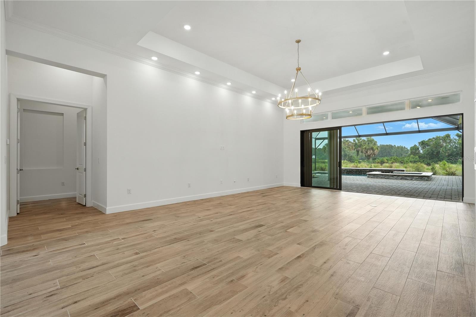 Living to Primary Bedroom with Sliders Open