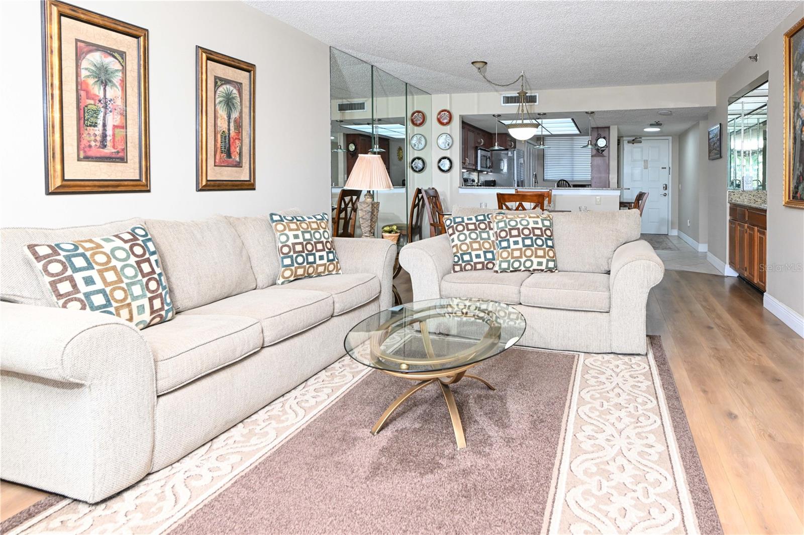 A living area with luxury wide plank vinyl flooring provides a durable, stylish, and modern wood-look surface