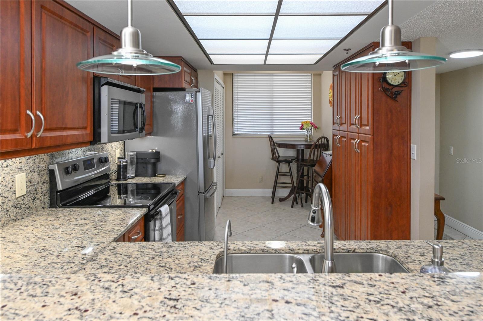 Kitchen featuring Upgraded Solid Wood Cabinets & Stone Countertops