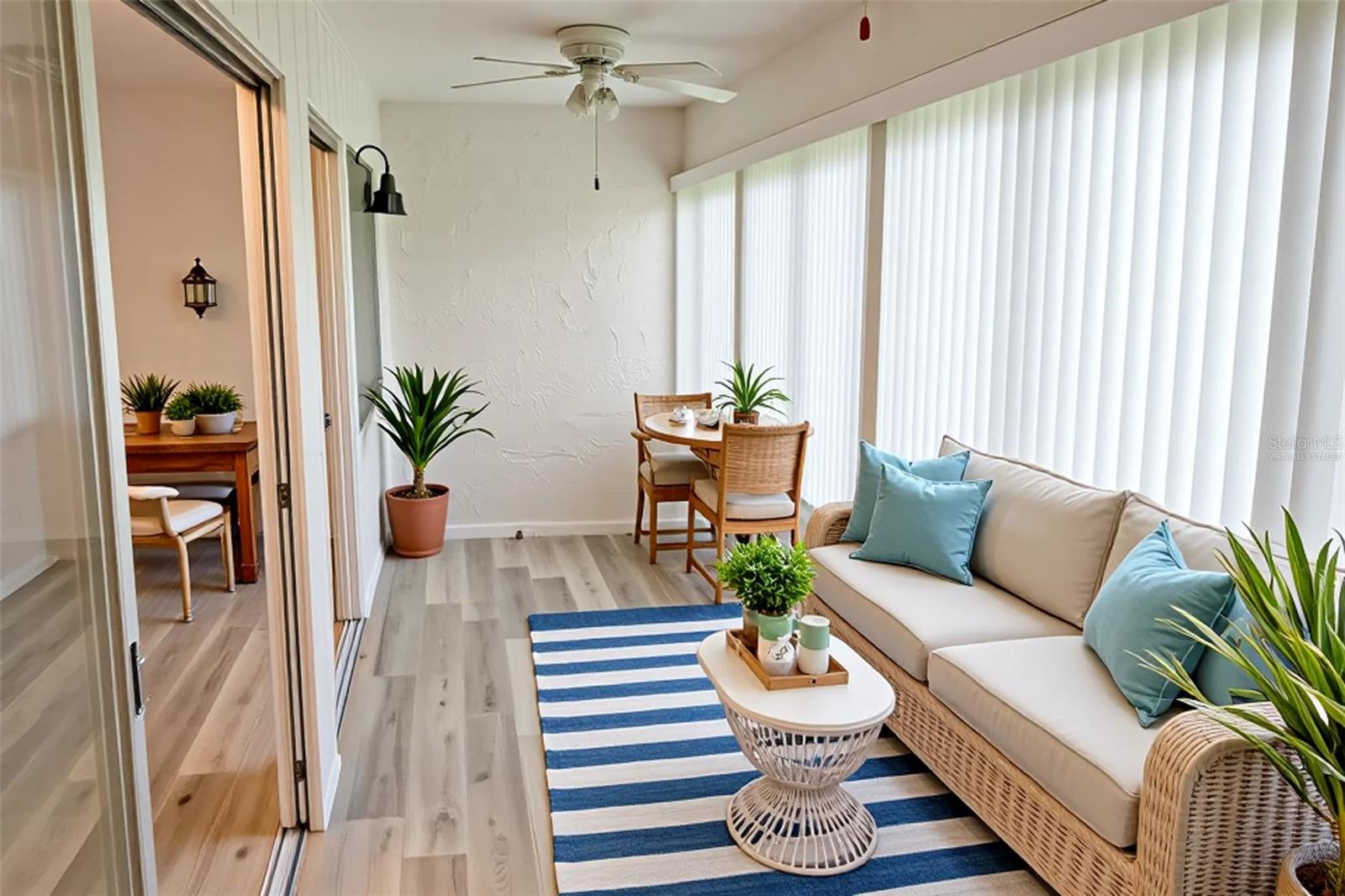 sliders lead to Florida room/virtually staged