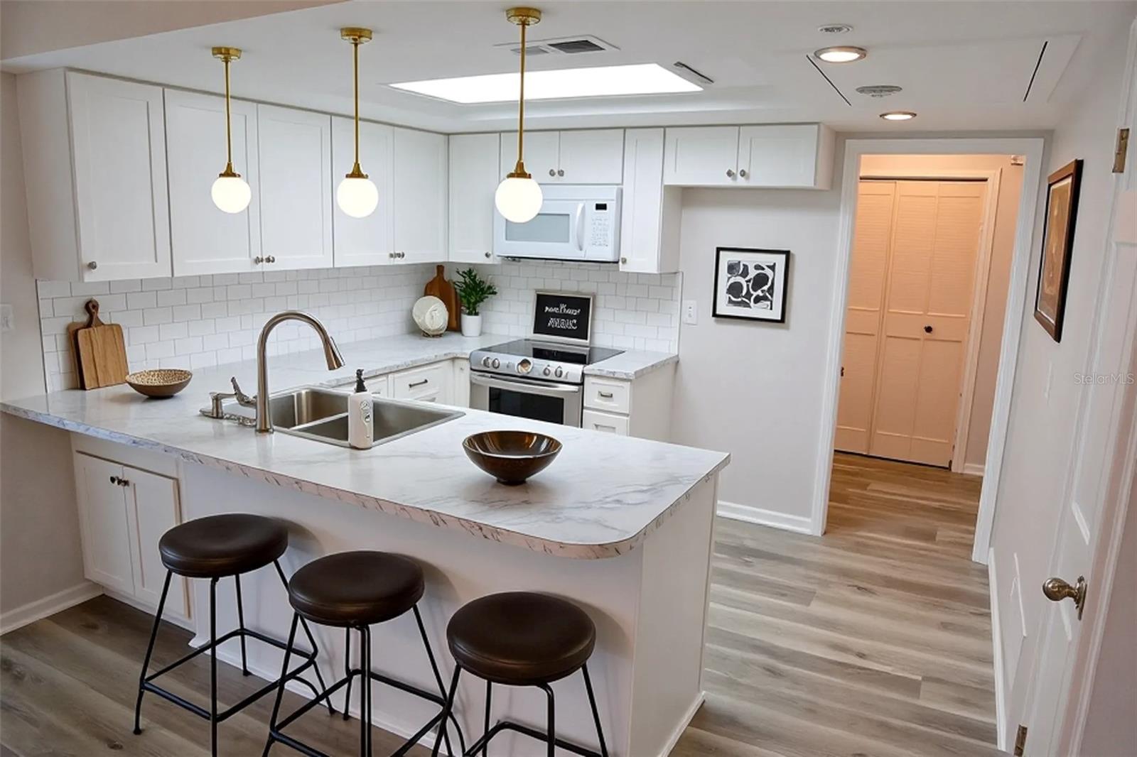 kitchen staged/ hanging lights and stove not included.